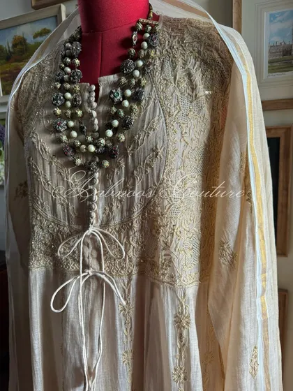 A close-up of the bodice and dupatta, showing the fine details of the embroidery and the fabric's texture.