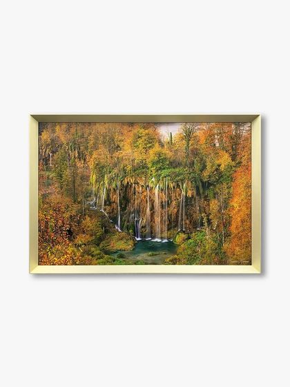 A straight-on view of the custom landscape artwork in a gold metal frame, showing how the frame adds a touch of warmth and elegance.