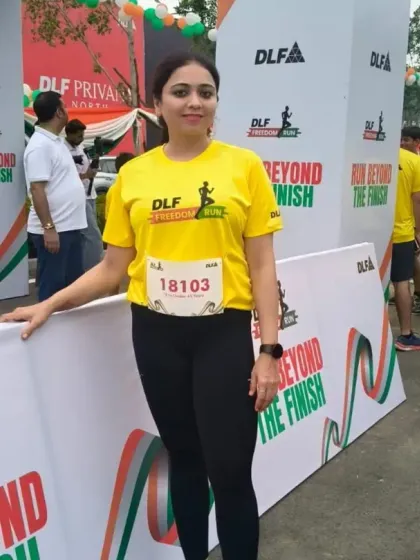 A participant proudly poses at the DLF Freedom Run photo booth. I create engaging, branded photo opportunities at every event, encouraging social sharing and creating lasting memories for runners.