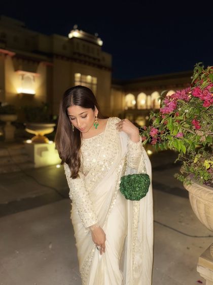 A close-up of the details. The delicate embroidery and the texture of the bag create a look that is both classic and interesting. As a bridal stylist, I focus on these small details that make a big impact.