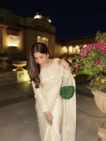 A close-up of the details. The delicate embroidery and the texture of the bag create a look that is both classic and interesting. As a bridal stylist, I focus on these small details that make a big impact.