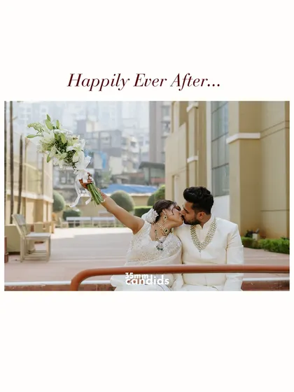 "Happily Ever After..." The couple shares a kiss on a city street, the bride joyfully raising her bouquet. A perfect, cinematic end to their wedding day story.