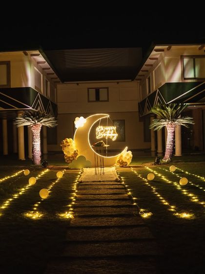 The entire outdoor venue lit up for the moon-themed birthday party, showcasing a truly spectacular transformation.