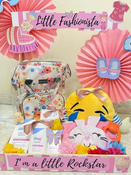 For the little fashionista in the making. This hamper includes a stylish floral diaper bag, baby wash products, and other essentials for a rockstar baby.