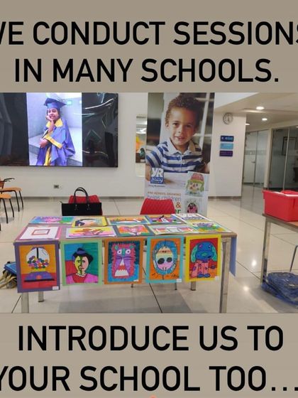We conduct sessions in many schools and can do the same for yours. This photo shows our booth at a school event, displaying the vibrant work of our students.