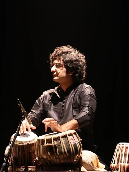 A shot from the 'Jazz meets Kathak' concert at the Royal Opera House. The dark background and spotlight create a dramatic effect, focusing all attention on the music.