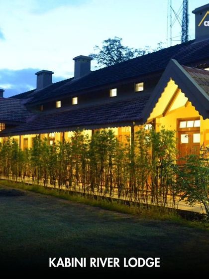 The warm, inviting glow of the Kabini River Lodge at dusk. This heritage property, a former royal hunting lodge, offers an authentic and comfortable base for exploring the incredible wildlife of the surrounding Nagarhole forest.