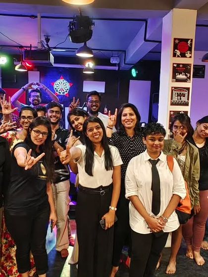 Another group of happy performers and audience members. This is the family we've built through music, poetry, and laughter.