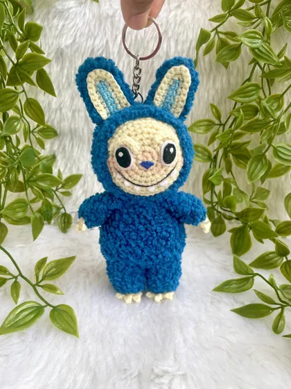 My crochet version of the trendy monster, Labubu! I used a fluffy, textured yarn for his blue suit to make him extra soft and huggable. This one can also be a keychain.