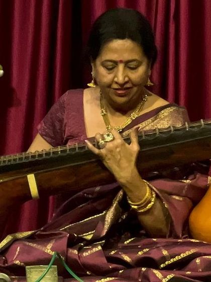 A close-up of me, completely absorbed in the music. This is my world, where every note from the veena tells a story.