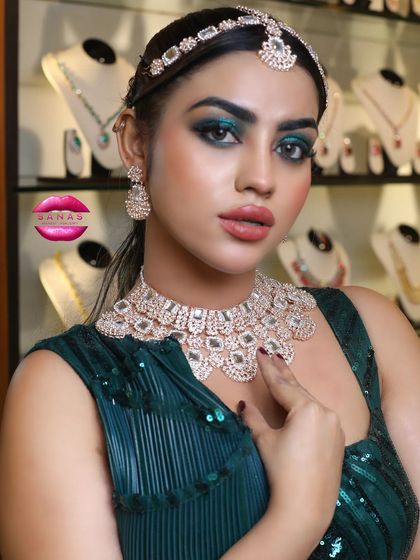 A glamorous look with a green smokey eye and diamond jewellery, created for a professional photoshoot. This is the level of quality and artistry I teach at my academy.