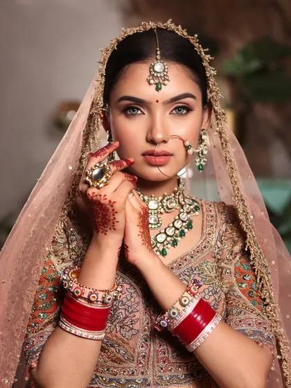 A bride's gaze holds a thousand dreams. We craft timeless bridal looks with meticulous attention to detail, from perfectly blended eyeshadow to a base that glows, ensuring you look nothing less than royalty on your big day.