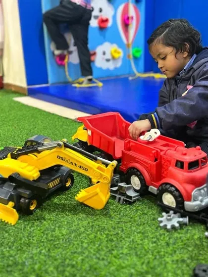 Learning through play is at the heart of what I do. Here, a student engages with construction toys, which helps develop fine motor skills and problem-solving abilities in a fun, hands-on way.
