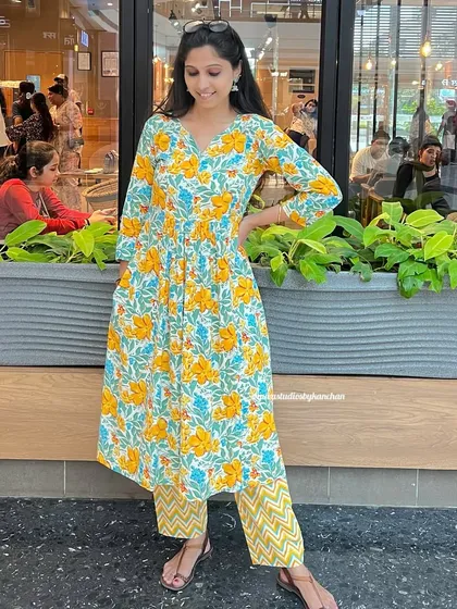 A comfortable yellow floral kurta-pant set, perfect for embracing a festive spirit. The kurta can also be worn as a one-piece dress, making it incredibly versatile.