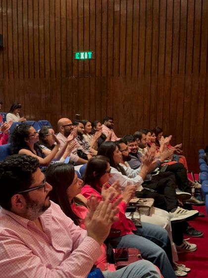 A shot of the proud parents and families, our biggest cheerleaders, applauding the incredible performances.