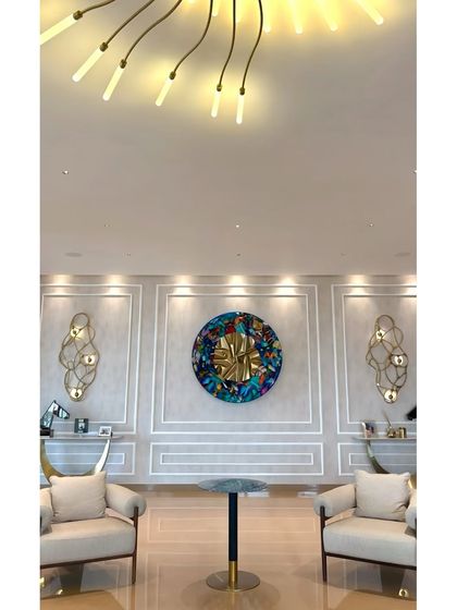 A wide shot showing how the large-scale butterfly piece anchors the formal living area.