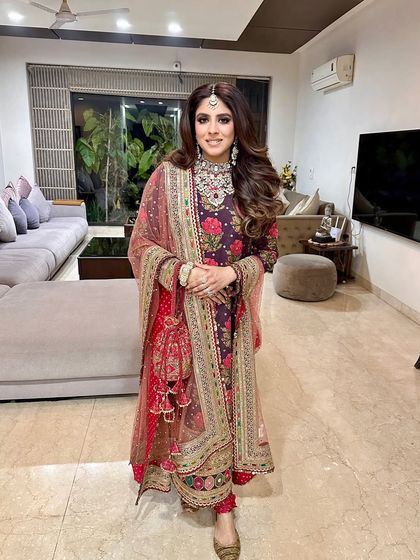 The full look, showing how the big, glamorous curls balance the ornate and elegant outfit.