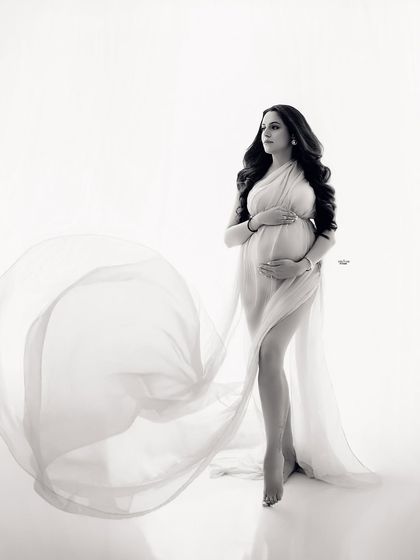 The same beautiful pose in timeless black and white. The monochrome edit really emphasizes the graceful lines and flow of the fabric.