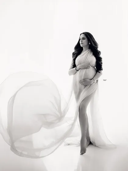 The same beautiful pose in timeless black and white. The monochrome edit really emphasizes the graceful lines and flow of the fabric.