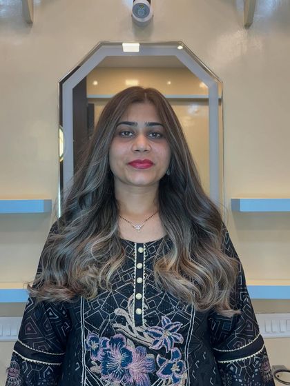 The final result, face-on. The new color and style frame her face beautifully, giving her a completely refreshed and modern look. Good hair gives you the confidence to deal with anything.