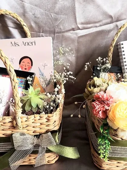 A beautiful basket hamper curated as a congratulatory gift. It includes a personalized notebook and mug, making it a thoughtful and unique present for any special occasion.