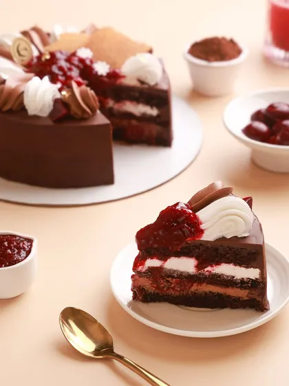 A look inside our classic Black Forest Cake. We use rich chocolate ganache, velvety vanilla bean cream, and a compote made from real, seasonal cherries to create this timeless, indulgent treat.