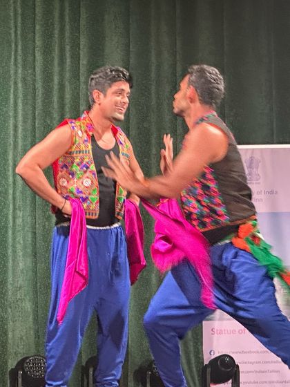 It's not just about steps, it's about the interaction and fun on stage. This candid moment from a folk dance piece shows the playful energy we encourage in our wedding choreography.
