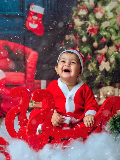 A joyful laugh from Santa's little helper. My Christmas mini-sessions are perfect for creating holiday cards and memories.
