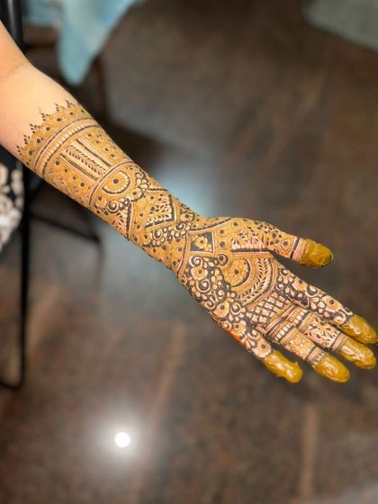 Another view of the engagement henna, showing the full arm coverage.