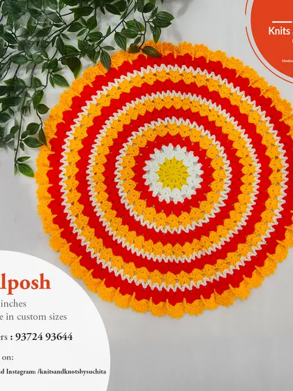 This thalposh uses a vibrant combination of red, yellow, and white in a striped pattern, perfect for festive occasions.