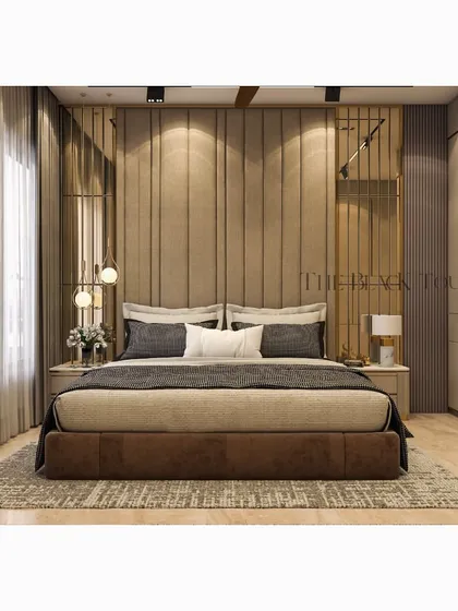 A 3D render of a luxurious bedroom with a warm, neutral palette. The design includes a floor-to-ceiling upholstered headboard, elegant gold accents, and layered lighting to create a cozy and opulent atmosphere.