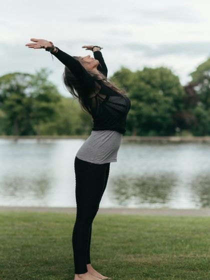 This image of Tadasana (Mountain Pose) by the water highlights its benefits for posture and balance. It strengthens the legs and helps relieve tension in the back, shoulders, and neck.
