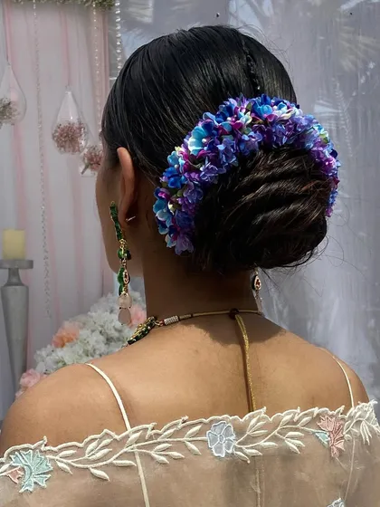The complete back view of this gorgeous and colorful floral bun, perfect for a bride who wants to make a statement.