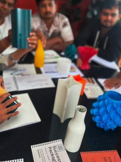 Our team engaging in a workshop on 3D printing with bioplastics. We believe in continuous learning and integrating new technologies like smart furniture and customized solutions into our design process.
