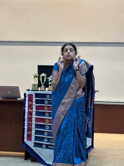 Even in a formal setting like the IIM Bangalore Orators Club, a story can break down walls. This is me, lost in the telling, using my hands and heart to bring a narrative to life for an audience of academicians and entrepreneurs.
