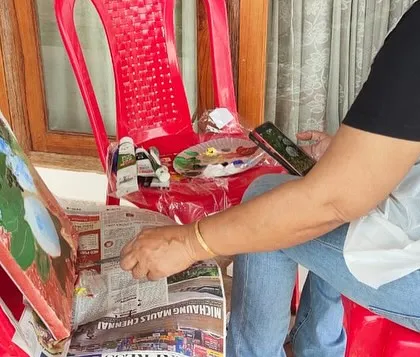 Me in my element, painting outdoors during the art camp in Kerala. My makeshift easel on a chair worked perfectly!