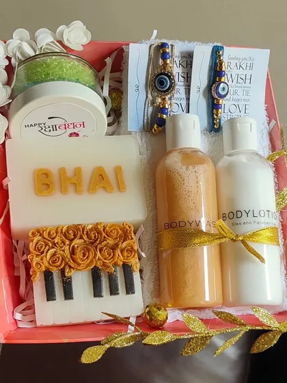 A musical-themed Rakhi hamper for a brother, with a piano soap, "Bhai" soap, body wash, lotion, and an evil eye rakhi.