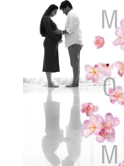 A beautiful blend of monochrome and color. This creative edit features a black and white silhouette of a couple, with delicate pink flowers adding a soft, artistic touch.