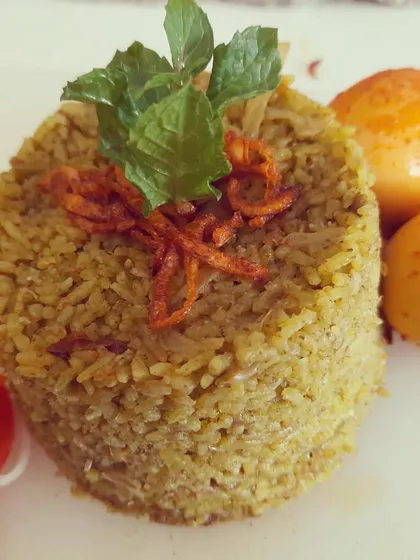 Here is my Thuppangadi Egg Biriyani, plated to show its rich texture. The rice is topped with fresh mint and fried onions, with the masala-coated eggs on the side. This is a dish that is both hearty and full of coastal Karnataka flavor.