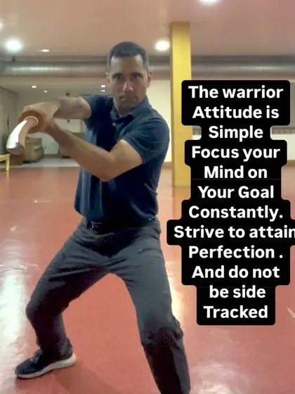 The warrior attitude is about constant focus on your goal. Here, I am practicing with a training tool to improve precision and power, embodying the principle of striving for perfection without distraction.
