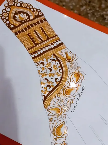 A partial view of the practice design, showing the delicate vine work.