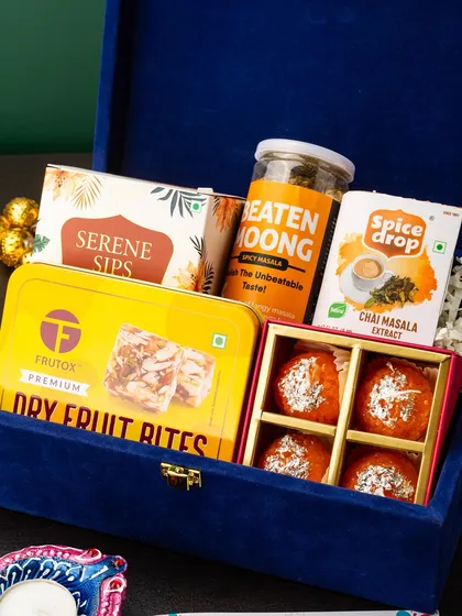 For a touch of corporate luxury, this hamper is presented in a stunning royal blue velvet box. It’s curated with a mix of gourmet treats like dry fruit bites and motichoor ladoo, along with healthy snacks and artisanal tea. This is how I help businesses show appreciation to their clients and partners during the festive season.