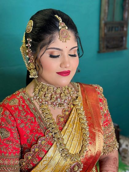 A moment of quiet elegance. The soft, glowing makeup and classic red lip create a look that is both beautiful and timeless.
