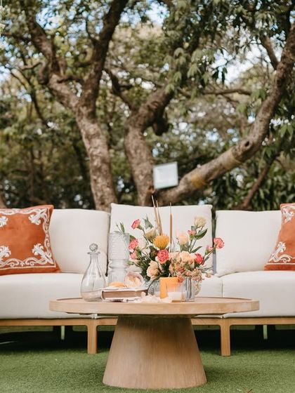 A comfortable lounge sofa with custom-printed cushions, providing a stylish and relaxed seating option for guests.