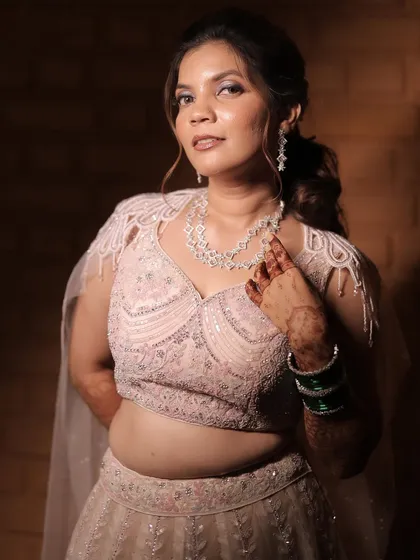 A close-up portrait of the bride, her sangeet makeup looking flawless and elegant.