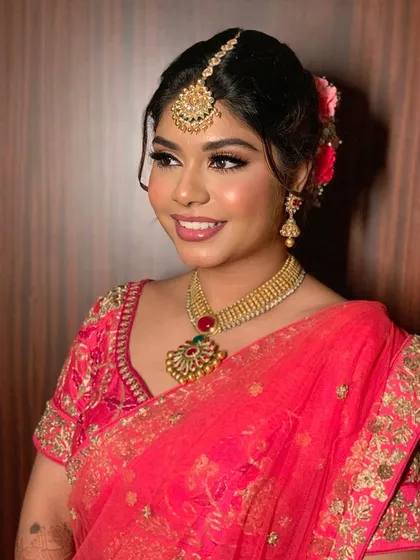 A radiant and happy bride. Simran's makeup was kept fresh and luminous to let her natural beauty be the centerpiece.