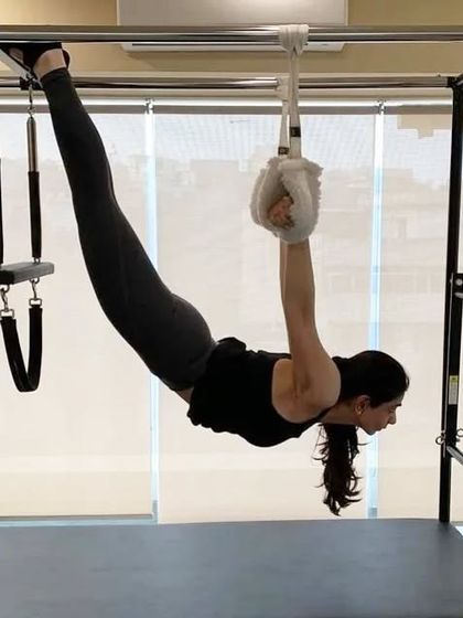 This client is using the Cadillac for a deep stretch and spinal decompression. This kind of movement is excellent for rehabilitation, as it enhances flexibility and improves body awareness in a low-impact way.