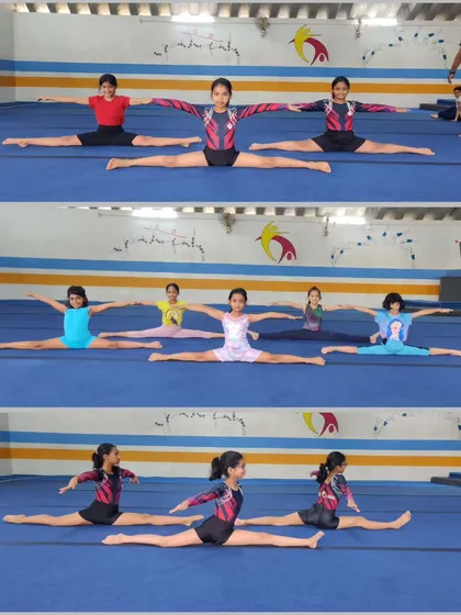 A group of our gymnasts holding their middle splits. Consistent practice of these stretches is what leads to such impressive flexibility.