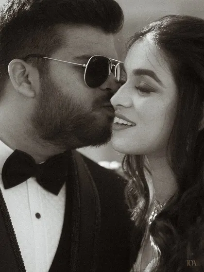 A romantic black and white close-up of the couple.