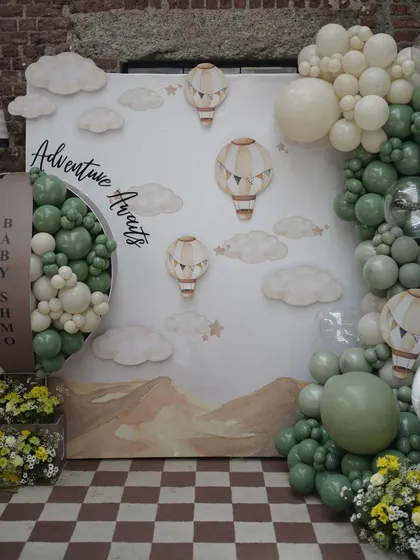 The centerpiece of our 'Adventure Awaits' baby shower, this custom backdrop features a hot air balloon motif, intricate balloon art, and personalized signage. We turn your Pinterest dreams into reality.